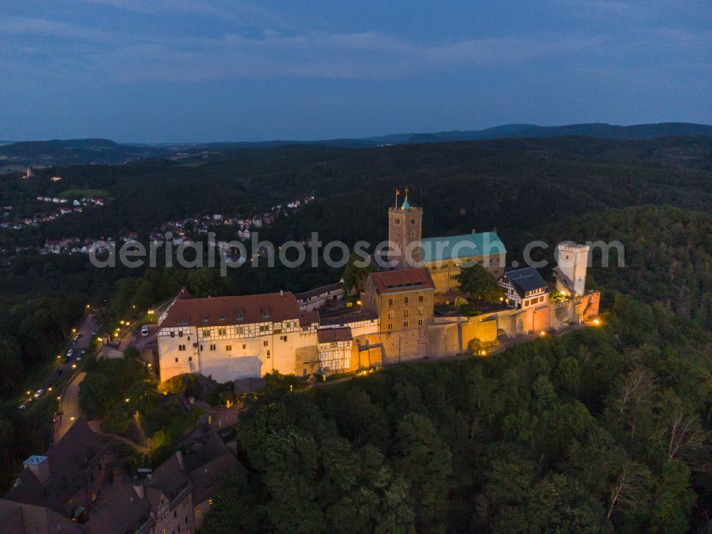 Aerial photograph at night Eisenach - Night lights and lighting at the Wartburg Fortress in Eisenach in the state of Thuringia, Germany