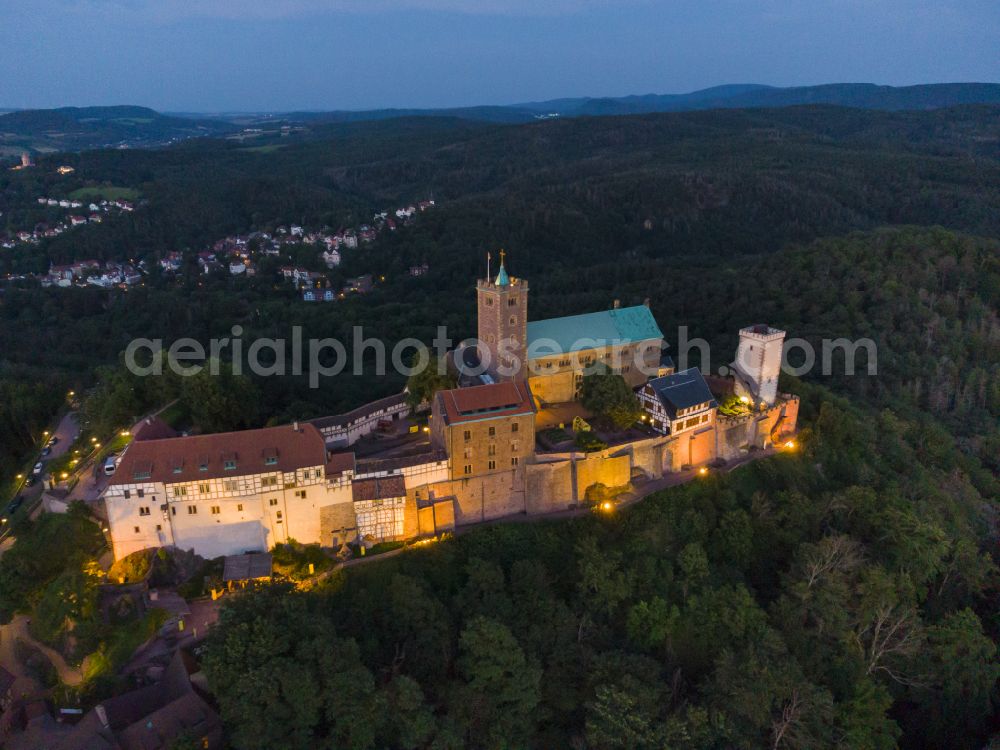 Aerial image at night Eisenach - Night lights and lighting at the Wartburg Fortress in Eisenach in the state of Thuringia, Germany