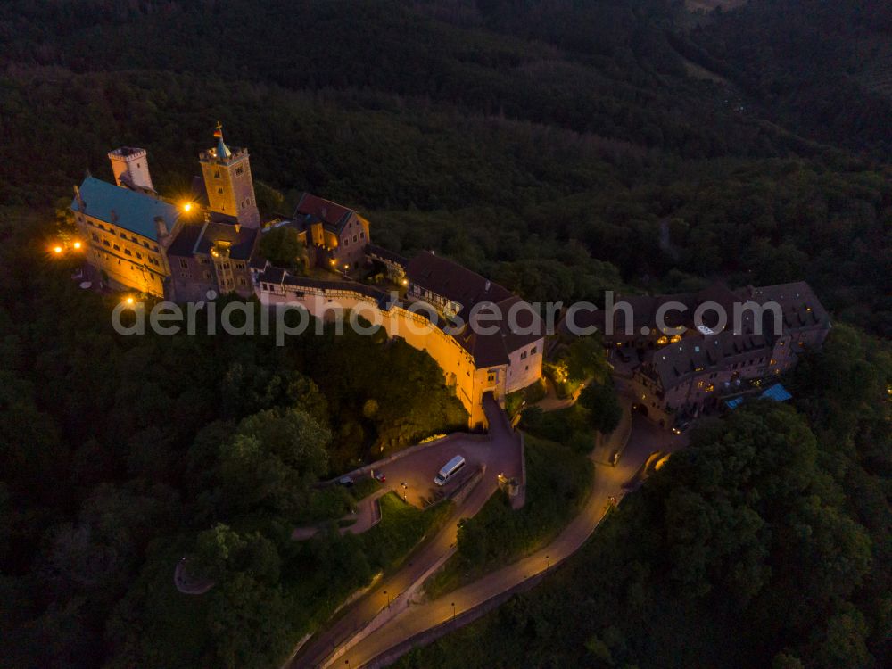 Aerial photograph at night Eisenach - Night lights and lighting at the Wartburg Fortress in Eisenach in the state of Thuringia, Germany