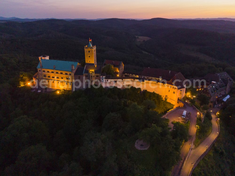 Aerial image at night Eisenach - Night lights and lighting at the Wartburg Fortress in Eisenach in the state of Thuringia, Germany