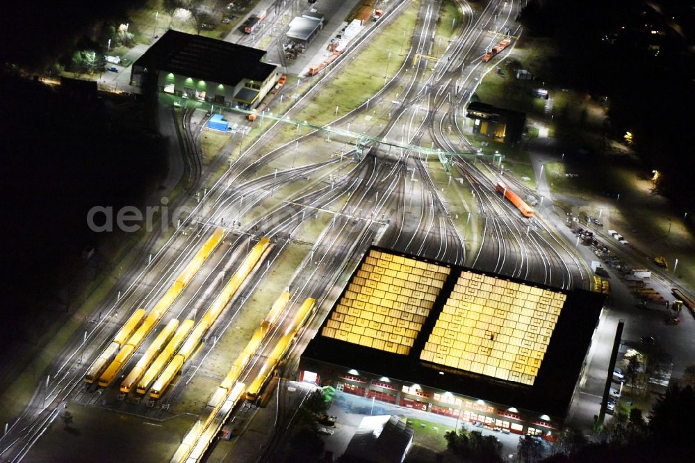 Aerial image at night Berlin - Night view company BVG underground service station at the Schlossweg in Berlin-Britz