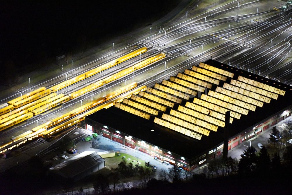 Aerial image at night Berlin - Night view company BVG underground service station at the Schlossweg in Berlin-Britz