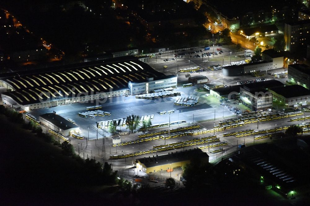 Aerial image at night Berlin - Night image with a view over the BVG bus and train station in the district Lichtenberg in Berlin