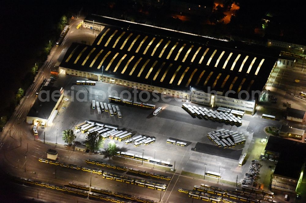 Aerial image at night Berlin - Night image with a view over the BVG bus and train station in the district Lichtenberg in Berlin