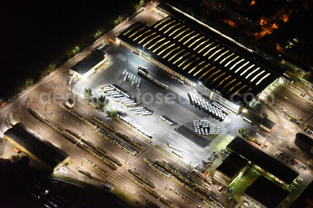 Berlin at night from the bird perspective: Night image with a view over the BVG bus and train station in the district Lichtenberg in Berlin