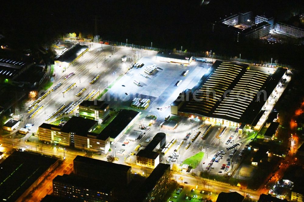 Aerial image at night Berlin - Night image with a view over the BVG bus and train station in the district Lichtenberg in Berlin