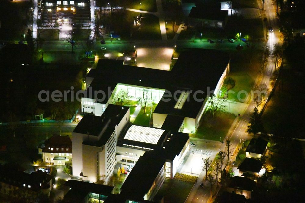 Aerial photograph at night Berlin - Night lighting Campus building of the university Freie Universitaet in Berlin, Germany