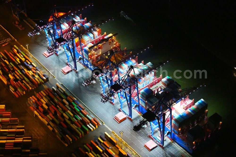 Hamburg at night from above - Night lighting container ship on den HHLA Container Terminal Tollerort Am Vulkonhafen in the port in the district Steinwerder in Hamburg, Germany