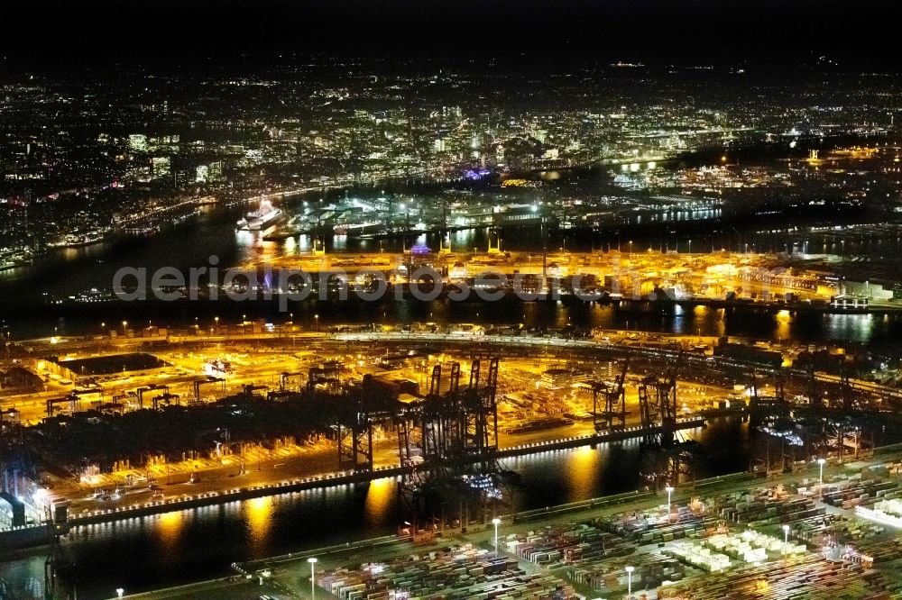 Aerial image at night Hamburg - Night lighting container Terminal in the port of the international port Hamburg overlooking the inner city in Hamburg, Germany