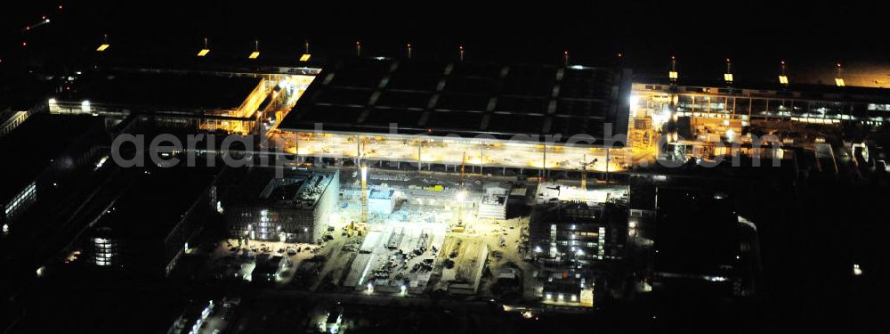 Aerial photograph at night Schönefeld - Nachtluftbild der Baustelle des neuen Terminals am Flughafen Berlin - Schönefeld. Der neue Terminal wird südlich des bisherigen Flughafens Berlin- Schönefeld errichtet. Ausführende Firmen: Hochtief AG; EUROVIA Beton; PORR; BERGER Bau; Karl Weiss; Matthai; Schäler Bau Berlin GmbH; STRABAG; Night Shot of Construction area of the new terminal at Schönefeld Airport (BBI). The new terminal is in the south of the airport Berlin -Schoenefeld quality built. Exporting companies: Hochtief AG; EUROVIA Beton; PORR; BERGER Bau; Karl Weiss; Matthai; Schäler Bau Berlin GmbH; STRABAG;