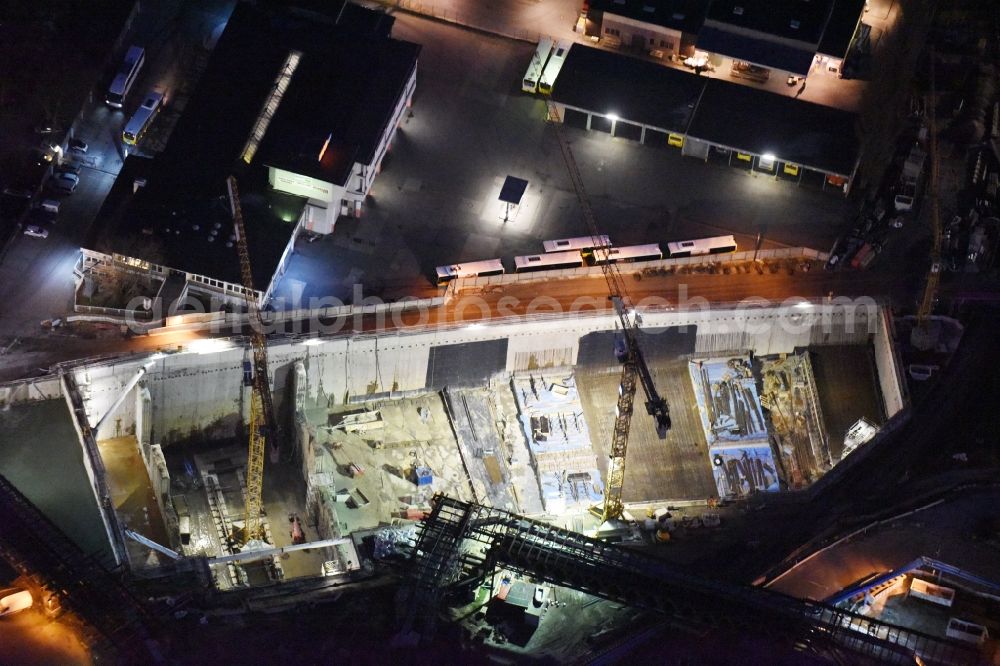 Berlin at night from above - Night image of the civil engineering construction sites for construction of the extension of the urban motorway - Autobahn Autobahn A100 in Berlin Neukoelln