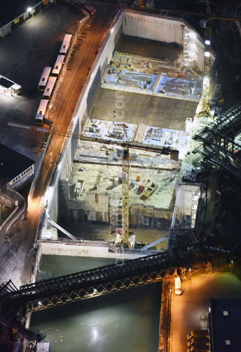 Berlin at night from above - Night image of the civil engineering construction sites for construction of the extension of the urban motorway - Autobahn Autobahn A100 in Berlin Neukoelln