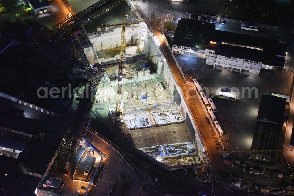 Aerial photograph at night Berlin - Night image of the civil engineering construction sites for construction of the extension of the urban motorway - Autobahn Autobahn A100 in Berlin Neukoelln