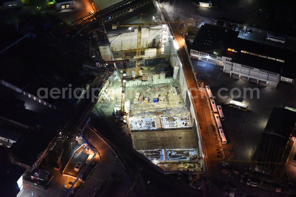 Berlin at night from above - Night image of the civil engineering construction sites for construction of the extension of the urban motorway - Autobahn Autobahn A100 in Berlin Neukoelln