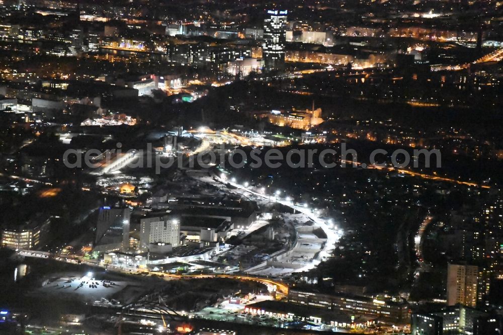 Berlin at night from the bird perspective: Night image of the civil engineering construction sites for construction of the extension of the urban motorway - Autobahn Autobahn A100 in Berlin Neukoelln