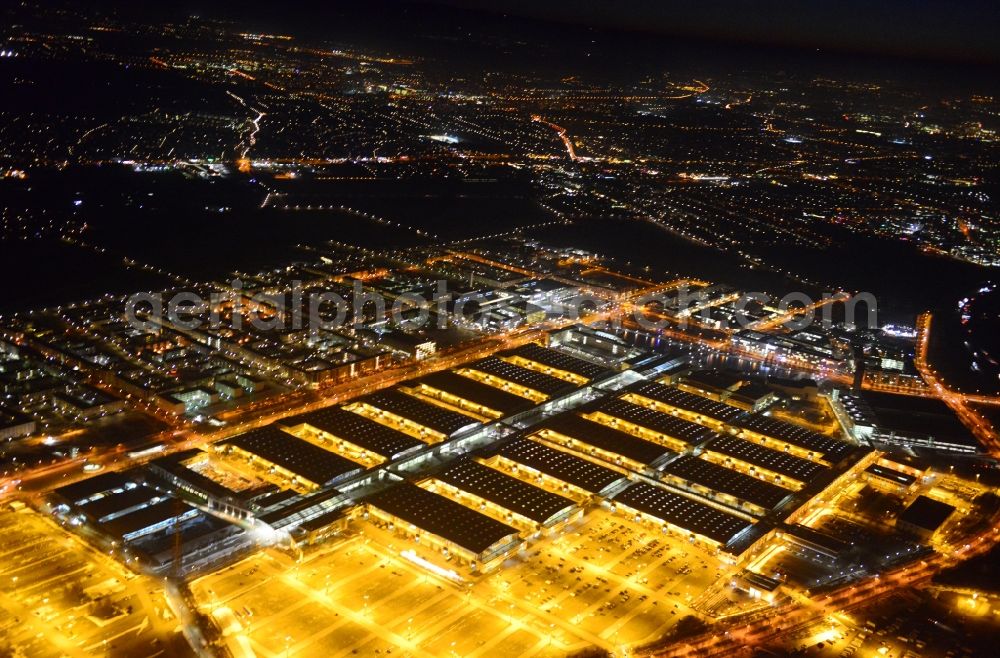 München at night from the bird perspective: Night view of the Fairgrounds Munich in the state Bavaria