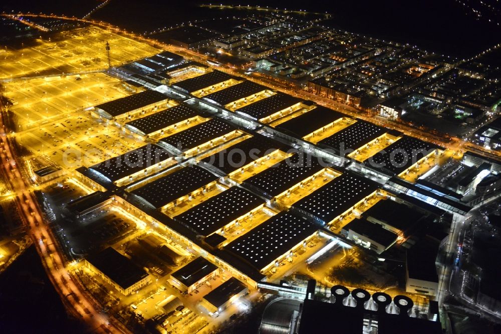 München at night from the bird perspective: Night view of the Fairgrounds Munich in the state Bavaria