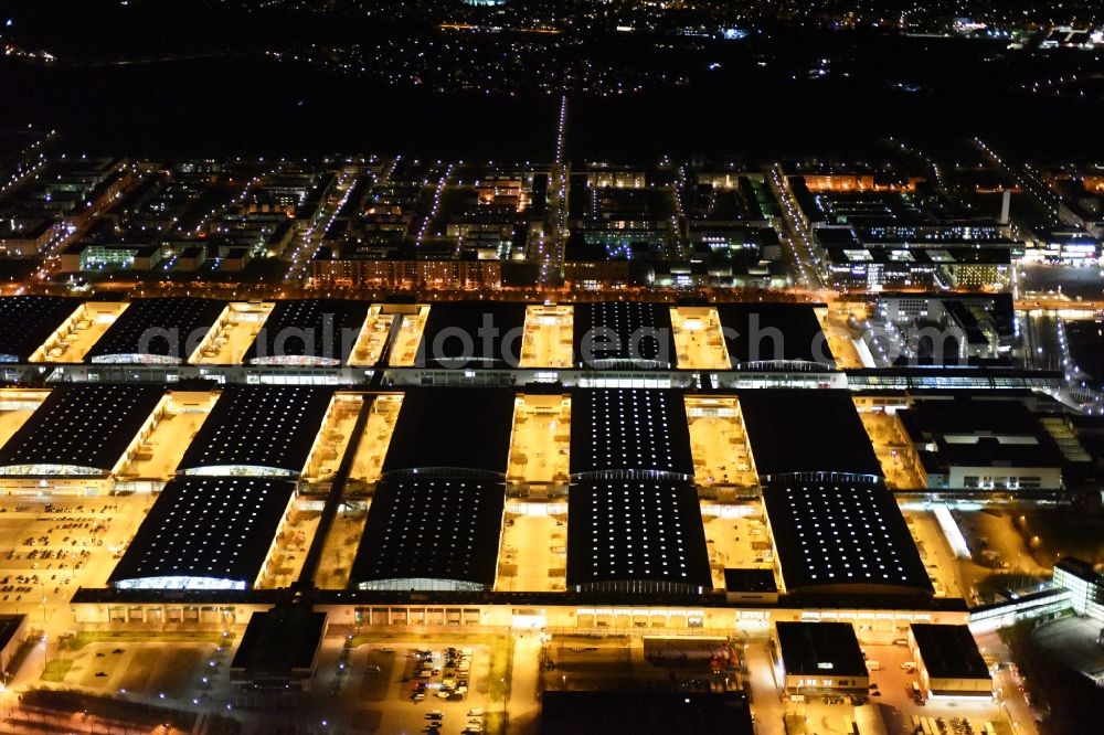 München at night from the bird perspective: Night view of the Fairgrounds Munich in the state Bavaria