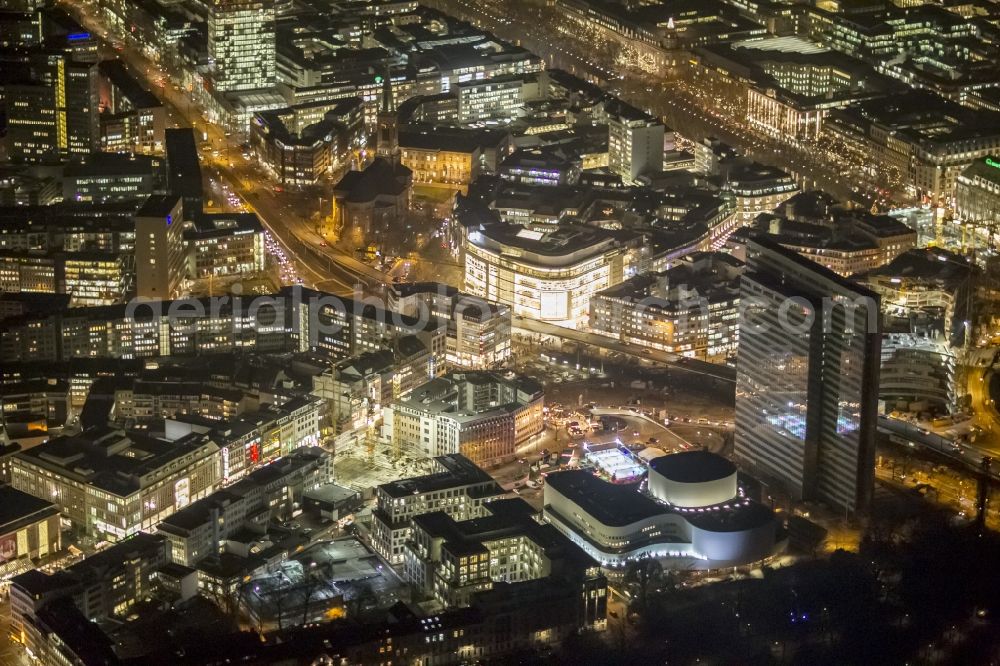 Aerial image at night Düsseldorf - Night aerial view of the illuminated city Duesseldorf on skyscraper Dreischeibenhaus and the Schauspielhouse in the state capital of North Rhine-Westphalia