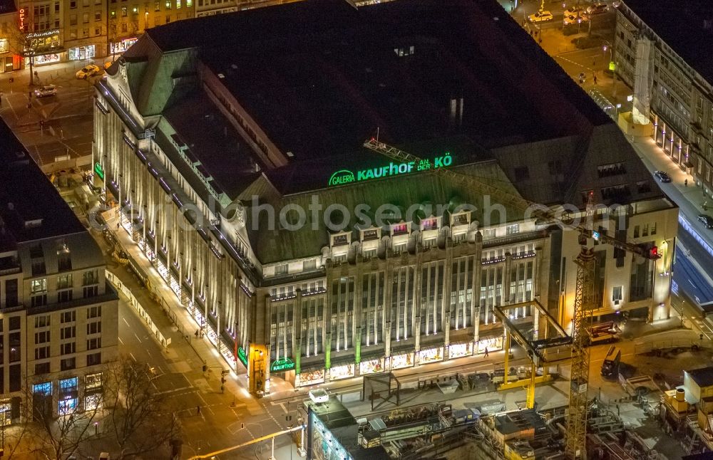 Düsseldorf at night from the bird perspective: Night aerial view of the illuminated buildings of the Galeria Kaufhof on KÖ in Dusseldorf in North Rhine-Westphalia