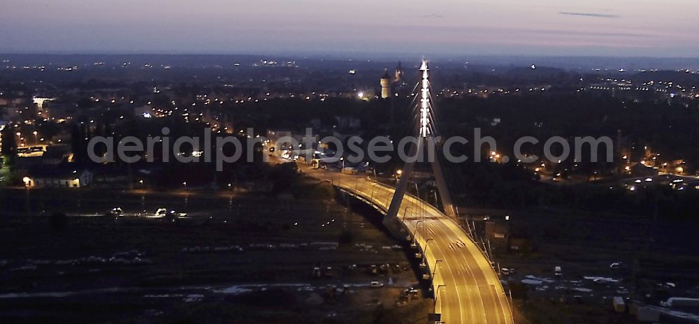 Halle (Saale) at night from above - Night aerial view of Berlin Bridge in Halle (Saale) in Saxony-Anhalt