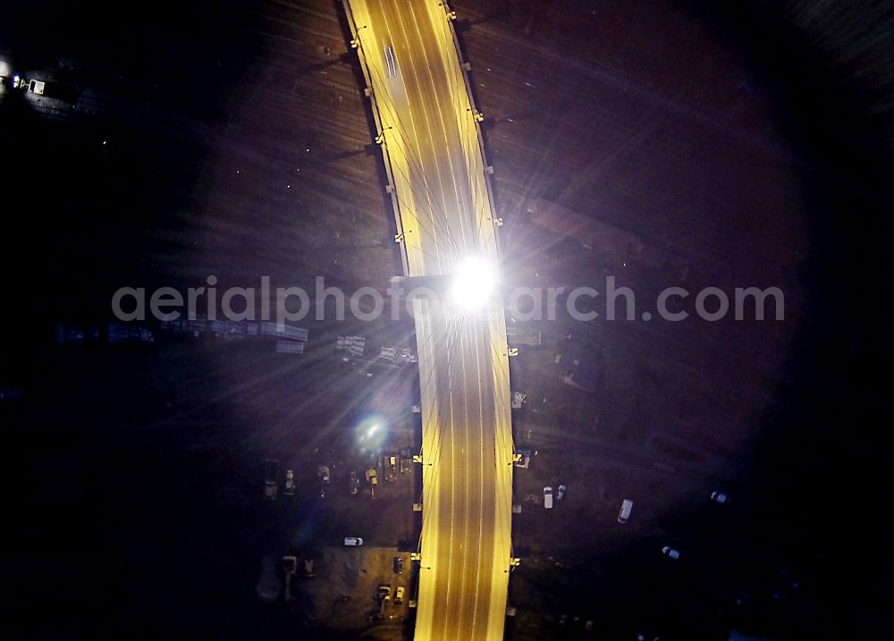 Halle (Saale) at night from the bird perspective: Night aerial view of Berlin Bridge in Halle (Saale) in Saxony-Anhalt