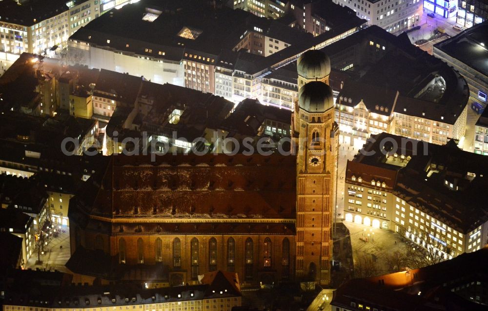 München at night from the bird perspective: City view of the Old Town at the Frauenkirche at the New Town Hall in the center of Munich in Bavaria