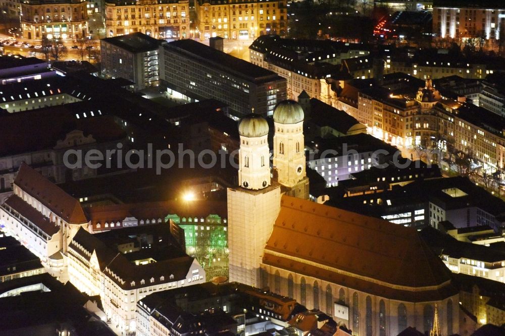 München at night from the bird perspective: City view of the Old Town at the Frauenkirche at the New Town Hall in the center of Munich in Bavaria