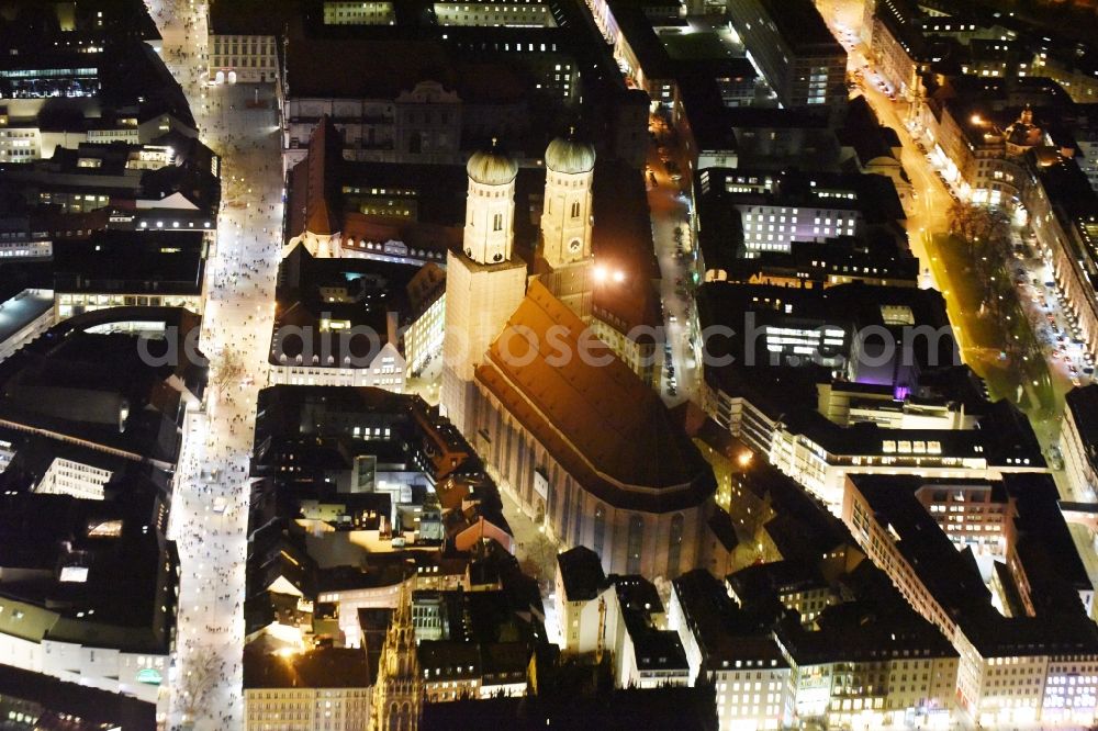 München at night from the bird perspective: City view of the Old Town at the Frauenkirche at the New Town Hall in the center of Munich in Bavaria