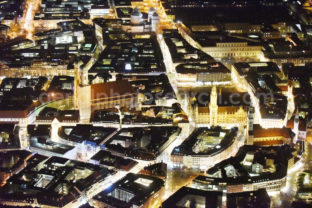 Aerial image at night München - City view of the Old Town at the Frauenkirche at the New Town Hall in the center of Munich in Bavaria