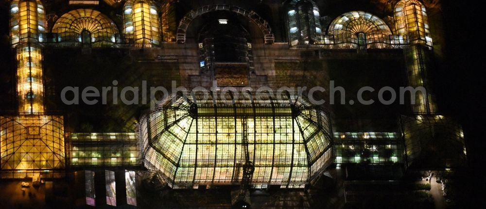 Berlin at night from above - Main building and greenhouse complex of the Botanical Gardens Berlin-Dahlem in Berlin. The historical glass buildings and greenhouses are dedicated to different areas. The Large Tropical House and the Victoria-House are located in the center