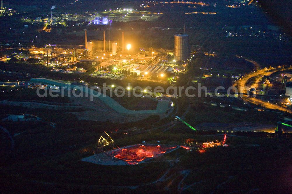 Aerial photograph at night Bottrop - Nachtluftbild der Kokerei Prosper, sie ist eine Kokerei mit Standort Bottrop. Sie ist eine der drei in Betrieb befindlichen Kokereien im Ruhrgebiet. Die Kokerei Prosper ist die letzte Kokerei, die von der Nachfolgegesellschaft der Ruhrkohle AG - der RAG Deutsche Steinkohle AG - noch betrieben wird.