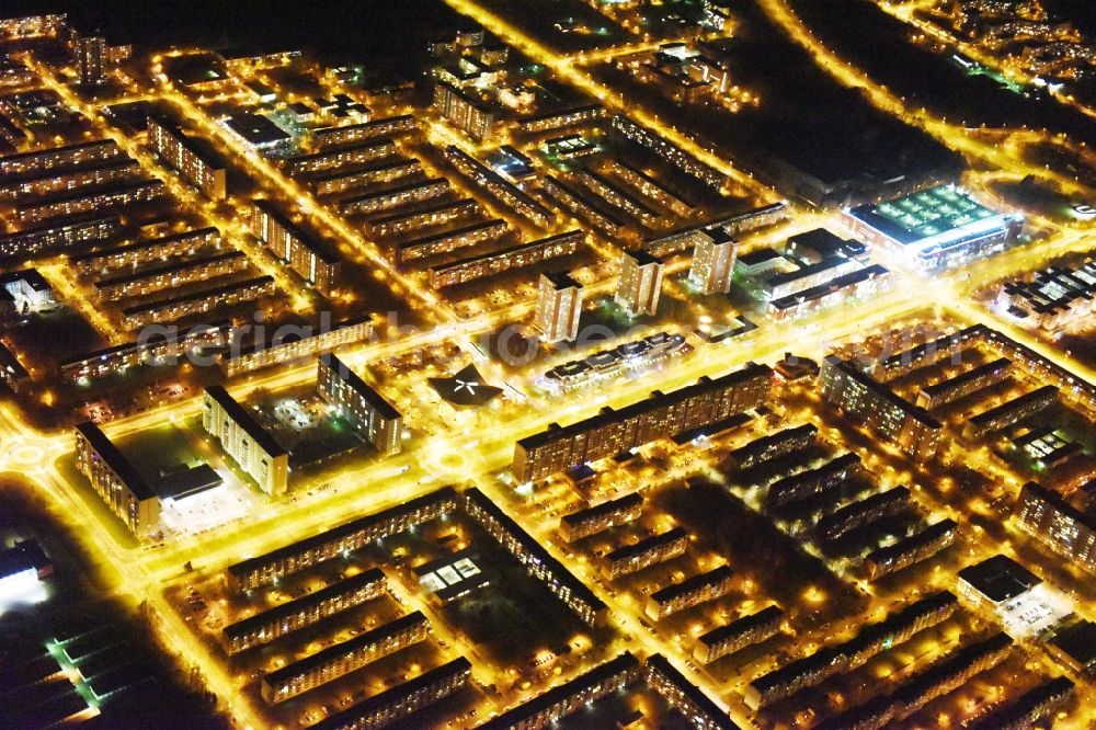 Rostock at night from above - Night view skyscrapers in the residential area of industrially manufactured settlement Luetten Klein aloung the Warnowallee in Rostock in the state Mecklenburg - Western Pomerania