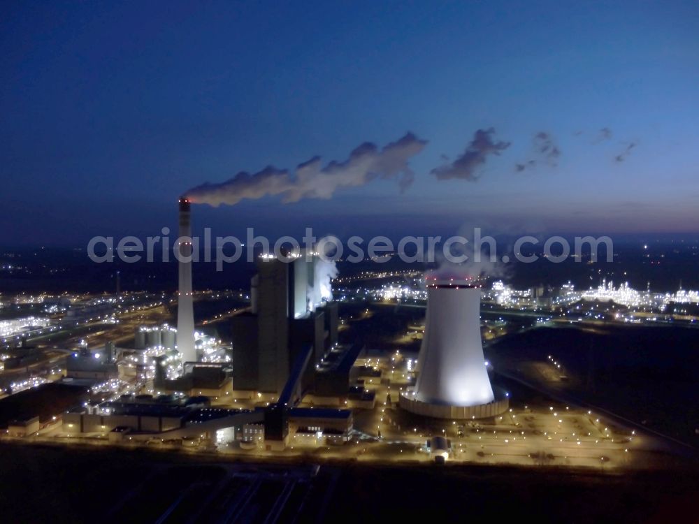 Aerial photograph at night Schkopau - Night view of power plant smokestacks in the mirror image of Rattmansdorfer pond in Schkopau in the state of Saxony-Anhalt. The two chimneys are part of the lignite-fired power plant of E.ON AG