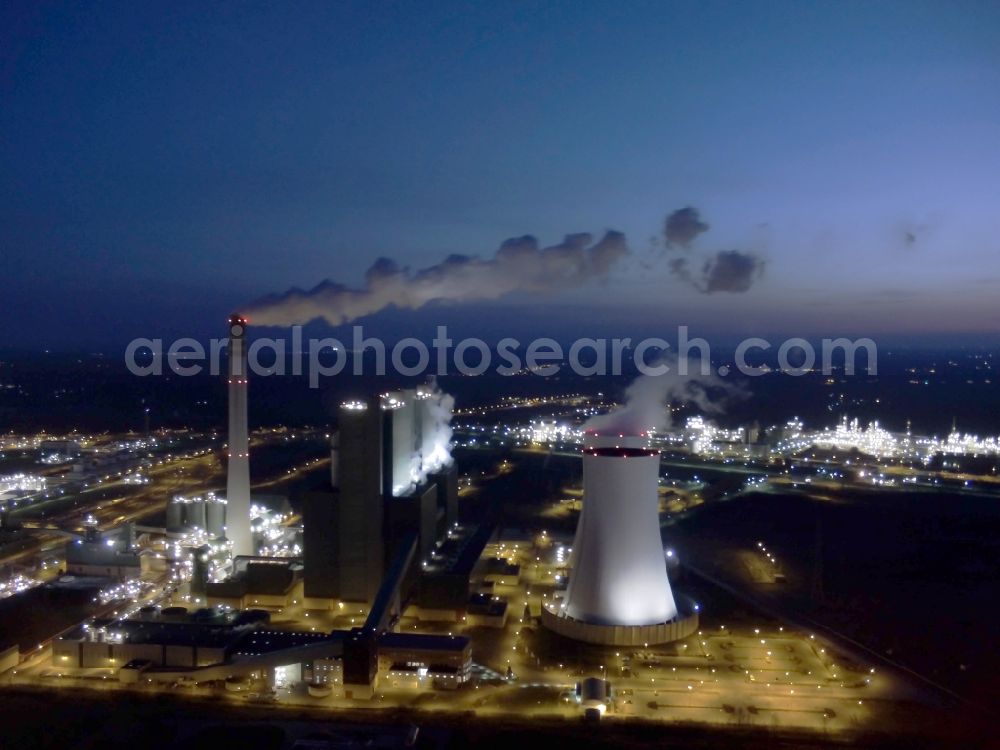 Aerial image at night Schkopau - Night view of power plant smokestacks in the mirror image of Rattmansdorfer pond in Schkopau in the state of Saxony-Anhalt. The two chimneys are part of the lignite-fired power plant of E.ON AG