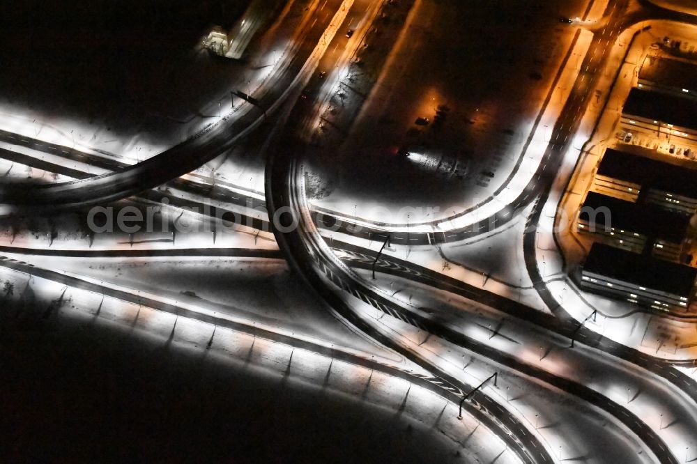 Schönefeld at night from the bird perspective: Night light image of the differently bright street lighting terminal at the new BER / BBI airport BERLIN BRANDENBURG AIRPORT Willi Brandt in Schoenefeld, Brandenburg