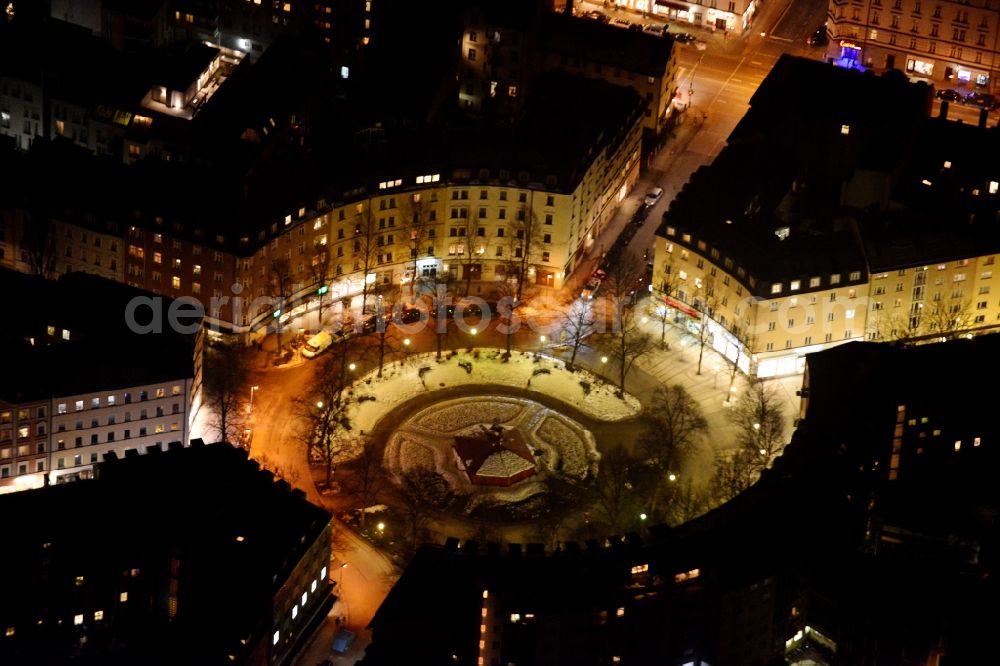 München at night from above - Night Aerial view of residential settlements on the circular place Weissenburger Platz in Munich in Bavaria