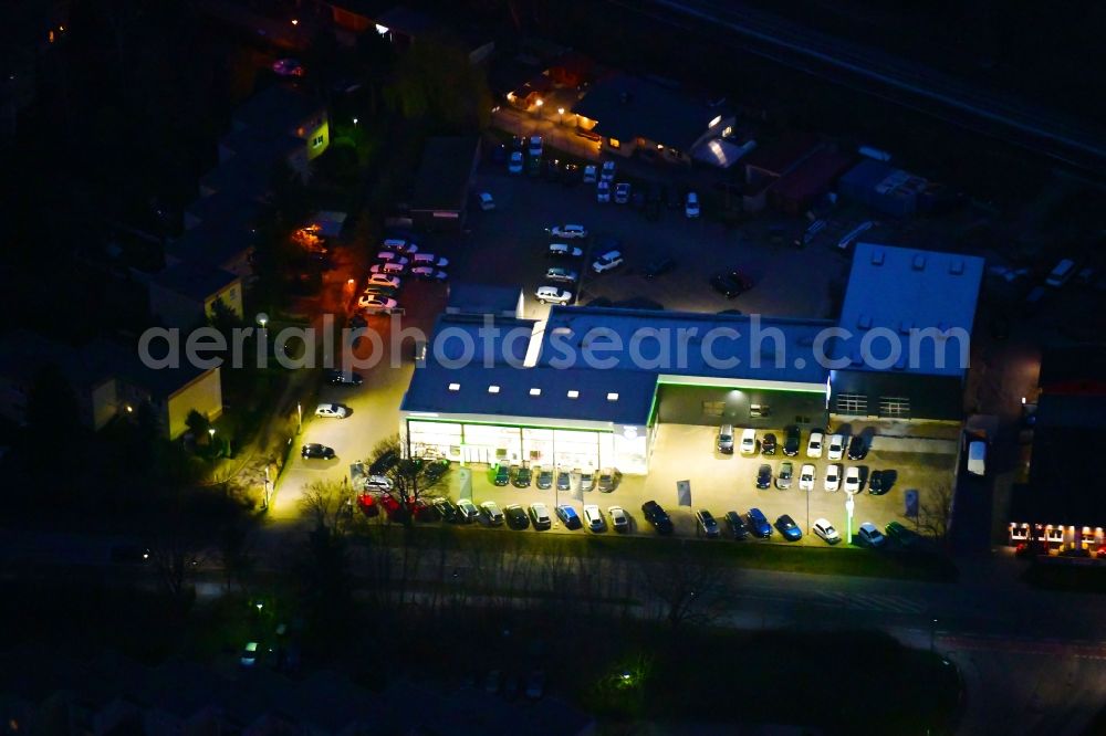 Aerial photograph at night Bernau - Night lighting car dealership building J.H.Auto(h)aus Europa in Bernau in the state Brandenburg, Germany