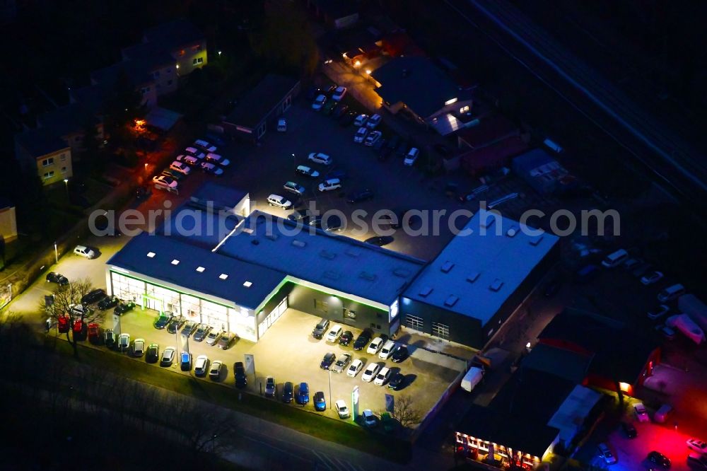 Aerial image at night Bernau - Night lighting car dealership building J.H.Auto(h)aus Europa in Bernau in the state Brandenburg, Germany