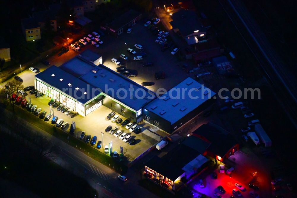 Bernau at night from above - Night lighting car dealership building J.H.Auto(h)aus Europa in Bernau in the state Brandenburg, Germany