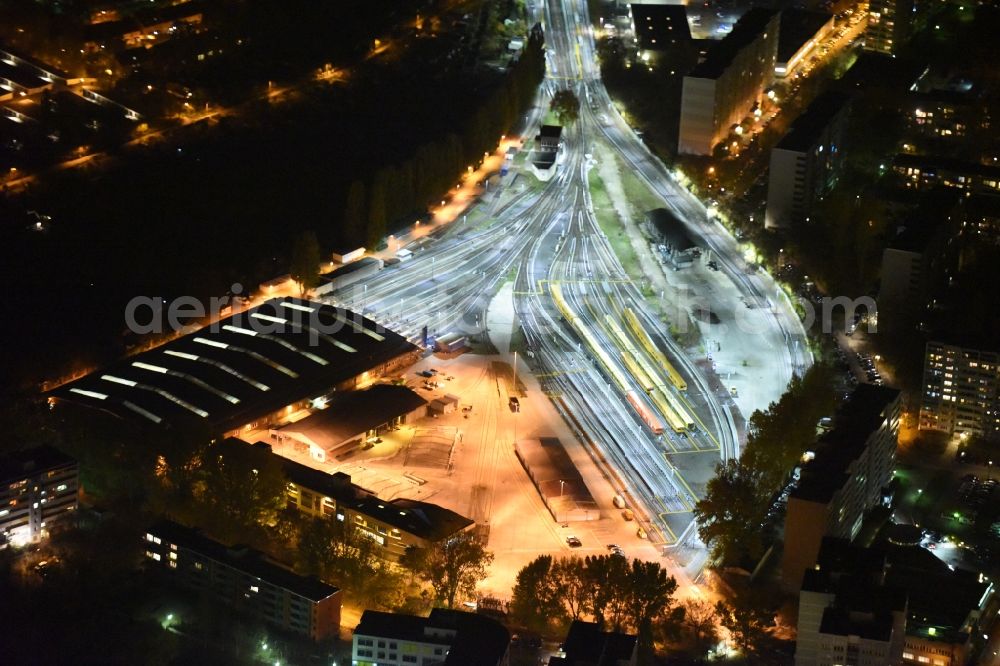 Aerial photograph at night Berlin - Night image of the company grounds and facilities of BVG subway workshops and depot including halls and production site in the Friedrichsfelde part in Berlin in Germany