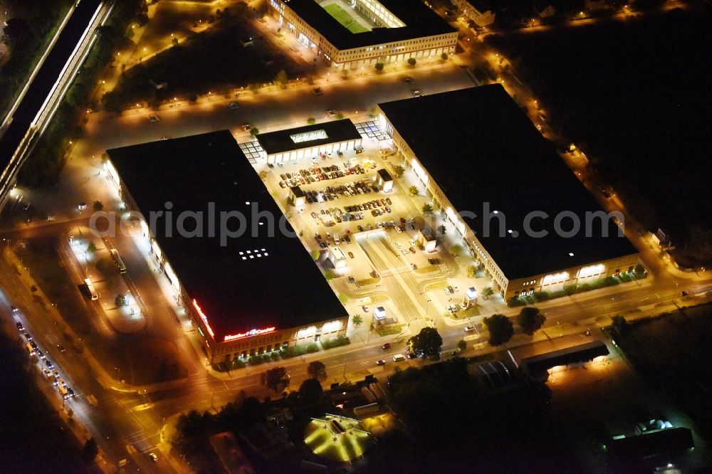 Aerial image at night Berlin - Night image of the shopping Mall Biesdorf Center between Weissenhoher St. und Koepenicker St. in Berlin Biesdorf