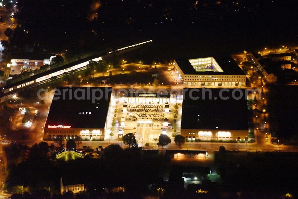 Aerial image at night Berlin - Night image of the shopping Mall Biesdorf Center between Weissenhoher St. und Koepenicker St. in Berlin Biesdorf