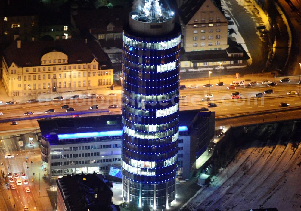 München at night from above - Night aerial view of the blue illuminated skyscraper Central Tower in Munich in Bavaria