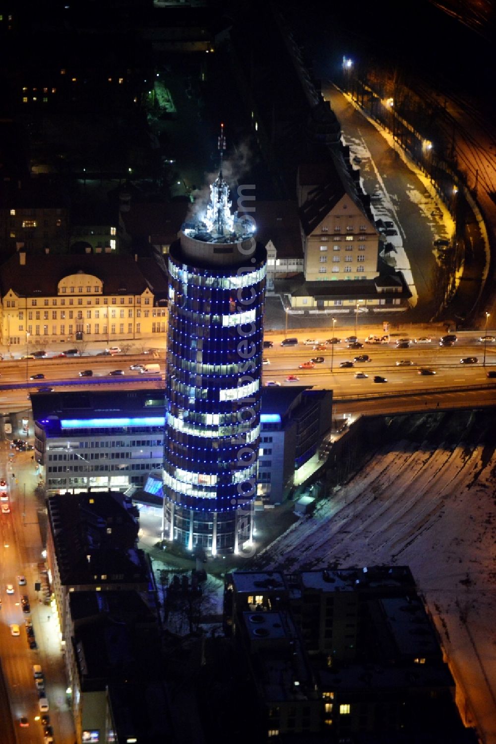 Aerial photograph at night München - Night aerial view of the blue illuminated skyscraper Central Tower in Munich in Bavaria