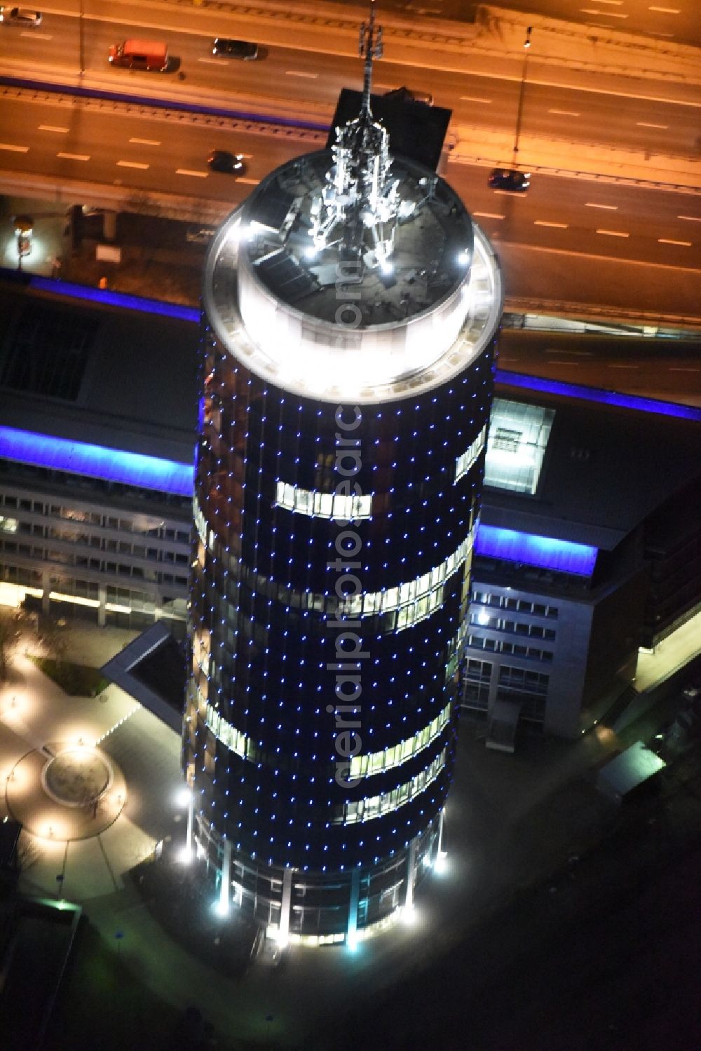 München at night from above - Night aerial view of the blue illuminated skyscraper Central Tower in Munich in Bavaria