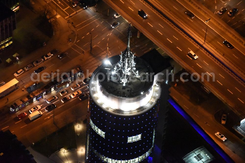 Aerial photograph at night München - Night aerial view of the blue illuminated skyscraper Central Tower in Munich in Bavaria