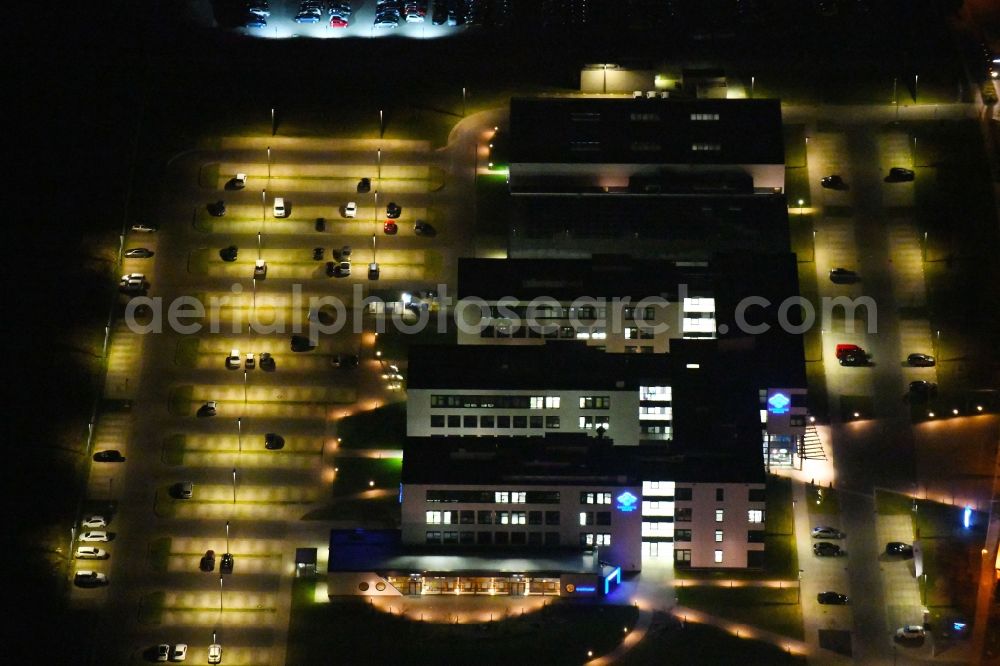 Hattorf-Heiligendorf at night from above - Night lighting Office building of Sumitomo Electric Bordnetze SE on Brandgehaege in Hattorf-Heiligendorf in the state Lower Saxony, Germany