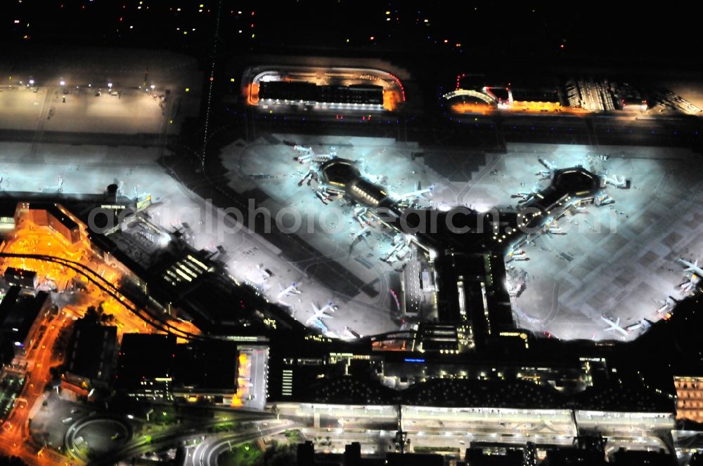 Aerial photograph at night Frankfurt am Main - Night view of Runway with hangar taxiways and terminals on the grounds of the airport in Frankfurt in the state Hesse