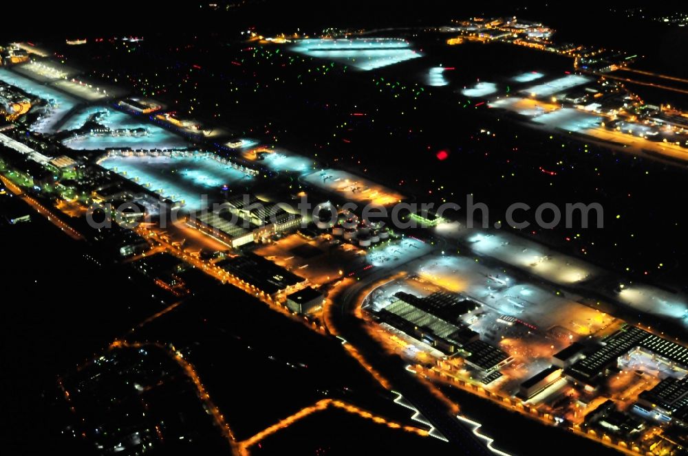 Aerial image at night Frankfurt am Main - Night view of Runway with hangar taxiways and terminals on the grounds of the airport in Frankfurt in the state Hesse